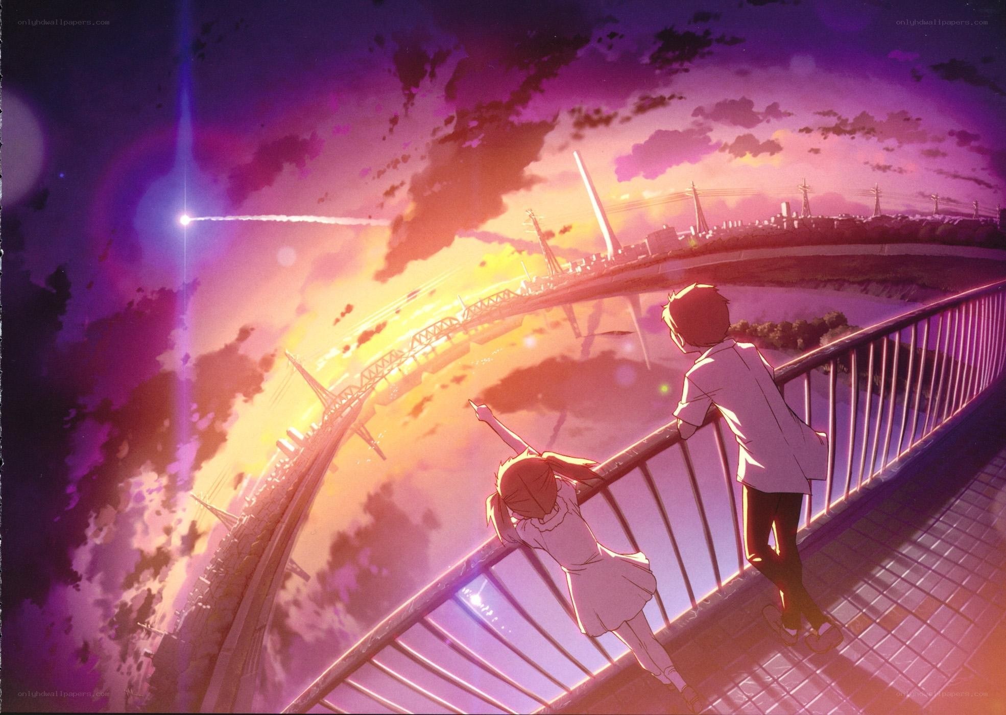 two children on a bridge at sunset