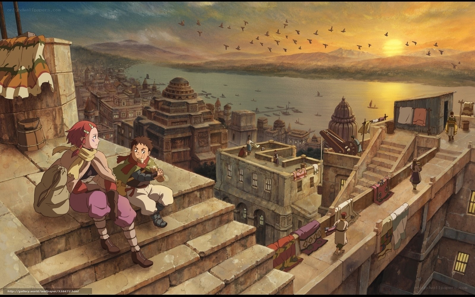 Two children on a rooftop at sunset