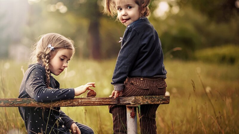 Two Children on Bench — Green, Peaceful, Afternoon