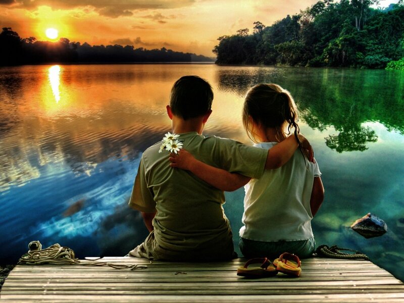 Two Children on Dock — Orange, Serene, Sunset, Photograph, Daisies