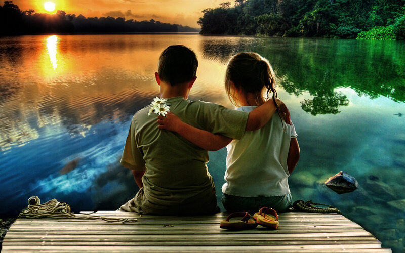 Two Children on Dock — Orange, Serene, Sunset, Photograph, River, Flowers, Green