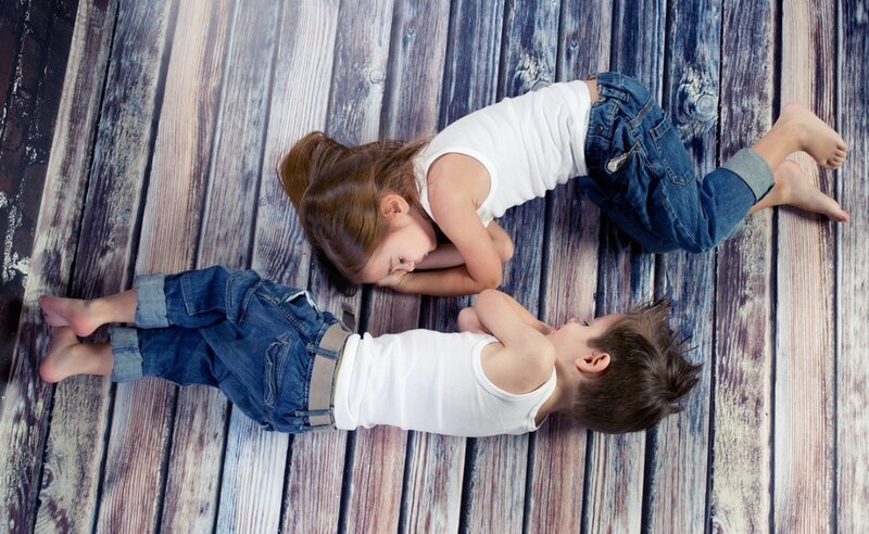 Two Children on Floor — Brown