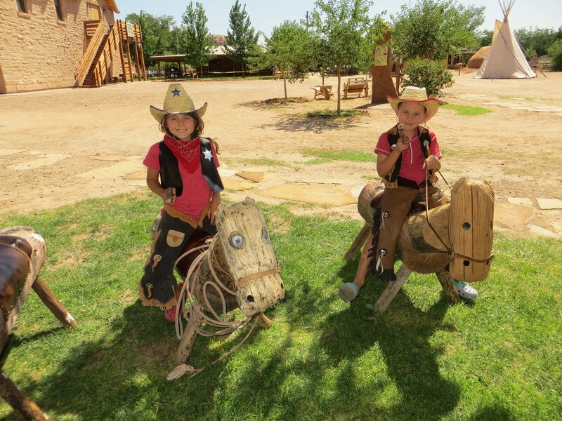 Two Children on Wooden Horses