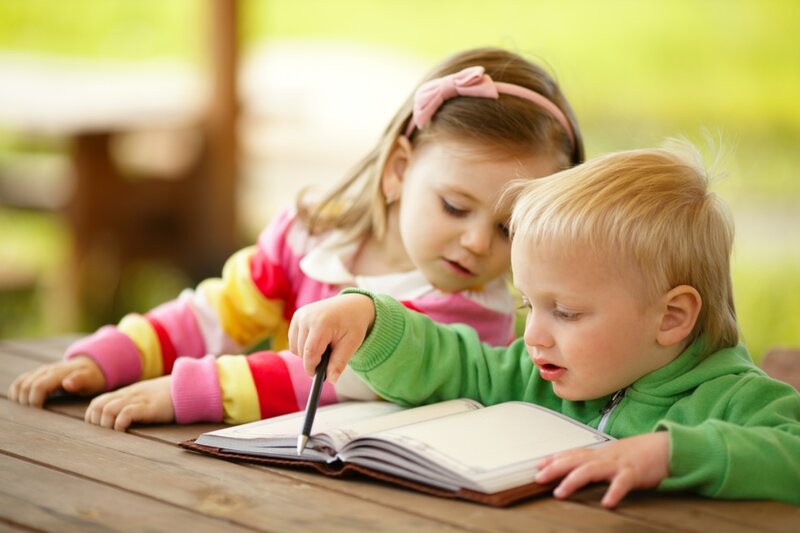 Two Children Reading Book — Green, Calm