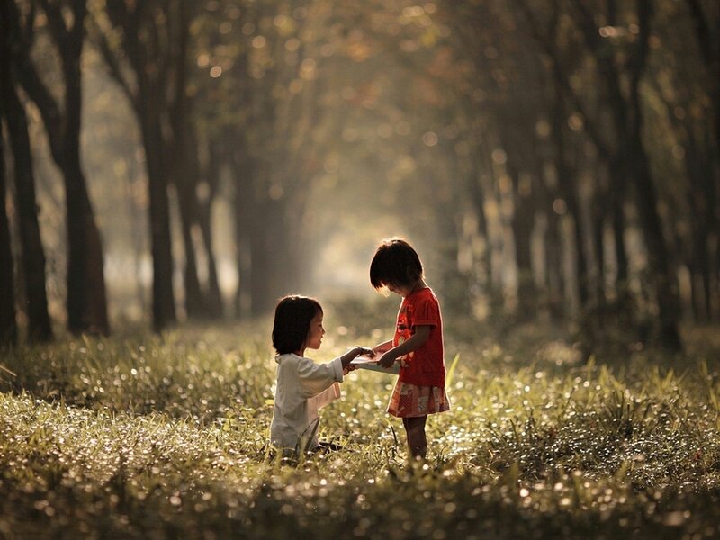 Two Children Sharing Book