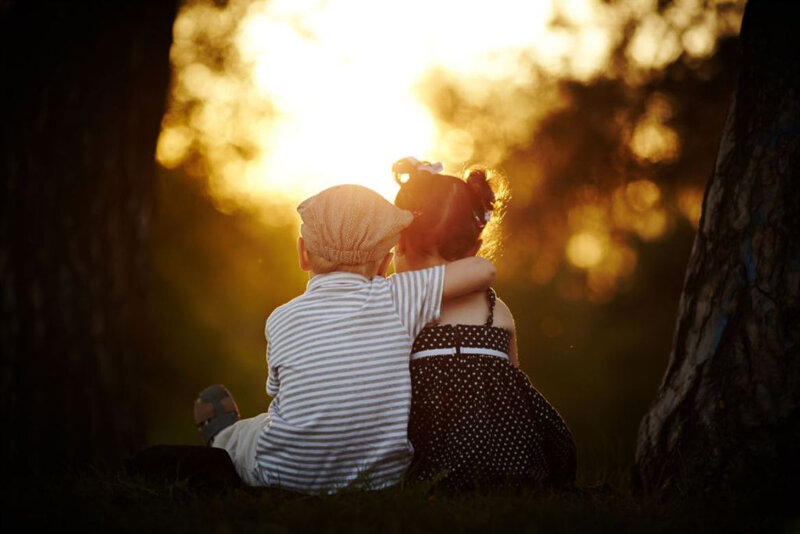 Two Children Sitting — Gold