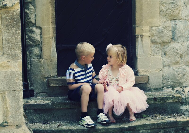 Two Children Sitting — Pink, Calm