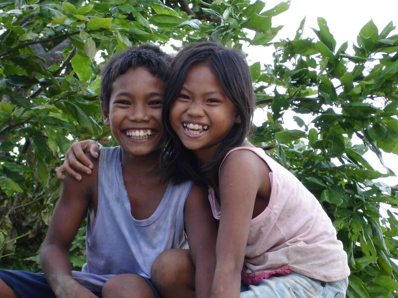 Two children smiling together