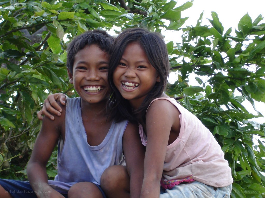 Two children smiling together