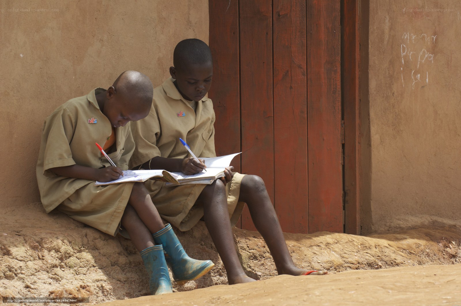 Two children studying outdoors