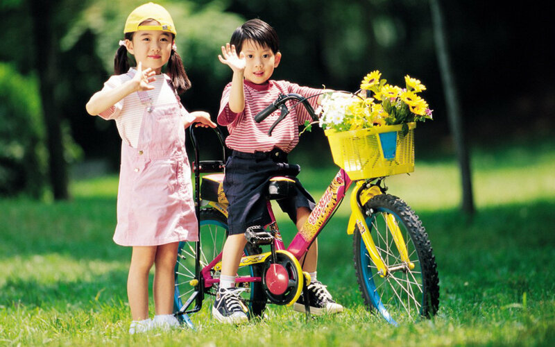 Two Children with Bicycle
