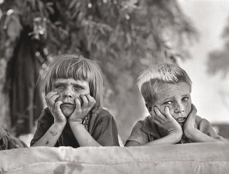 Two children with dirty faces