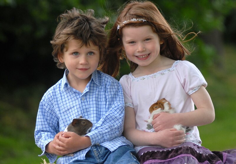 Two Children with Guinea Pigs