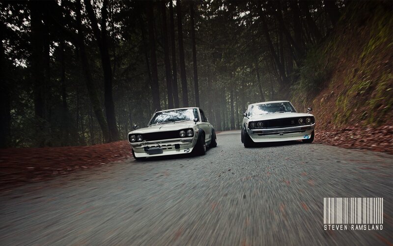 Two classic cars on a forest road
