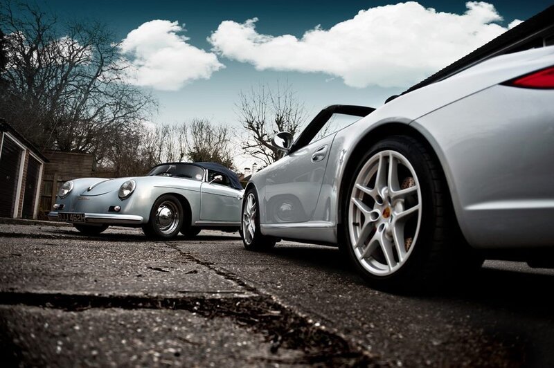 Two classic Porsches on a driveway