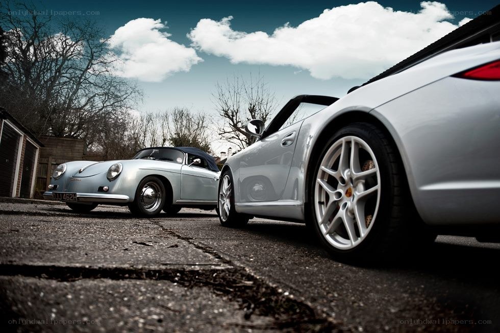 Two classic Porsches on a driveway