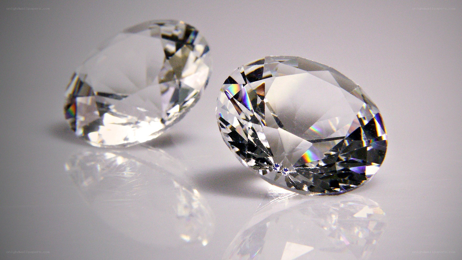 Two clear oval diamonds