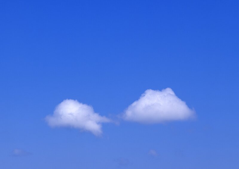 Two clouds in blue sky