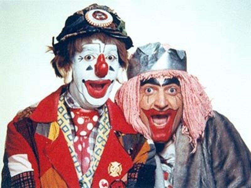 Two clowns posing together