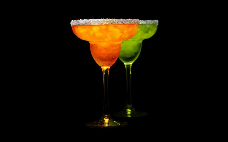 Two Cocktails in Glasses — Orange