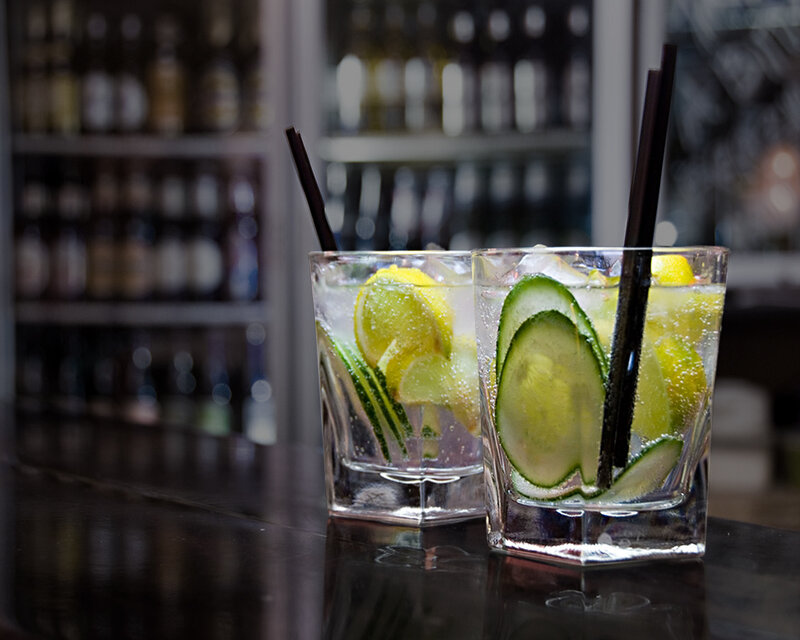Two cocktails on a bar