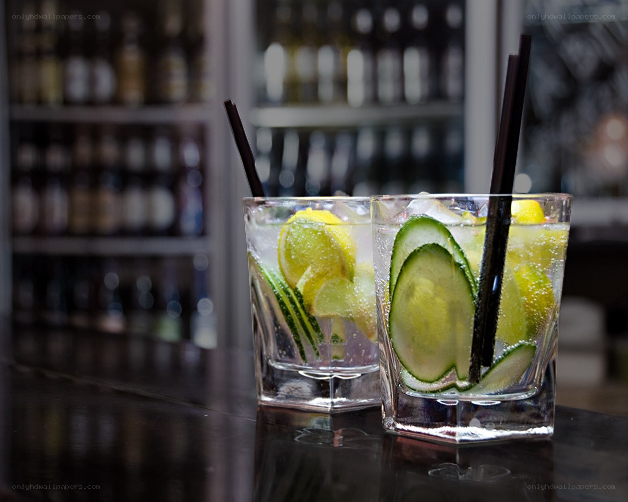 Two cocktails on a bar