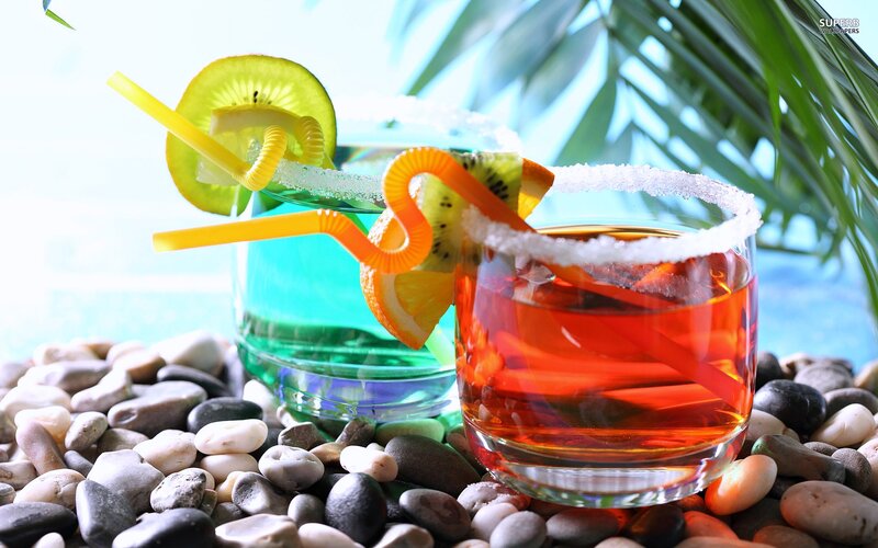 Two Cocktails on Pebbles — Red, Tropical