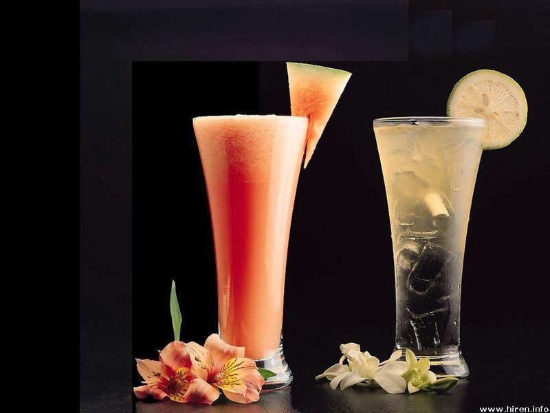 Two cocktails with garnishes