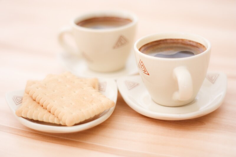 Two Coffee Cups and Biscuits