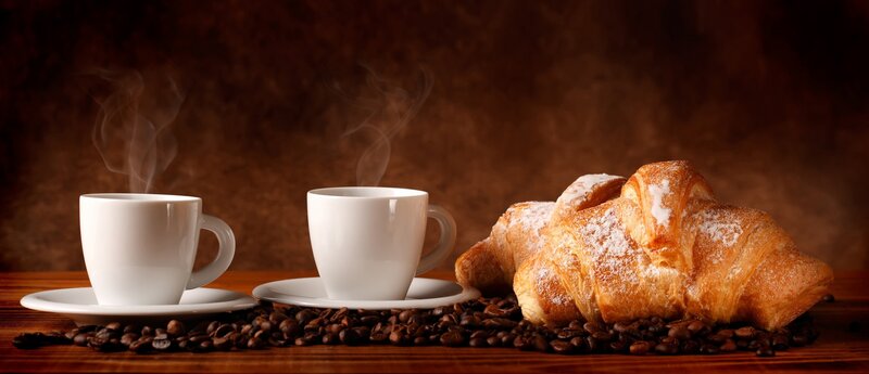 Two Coffee Cups and Croissant