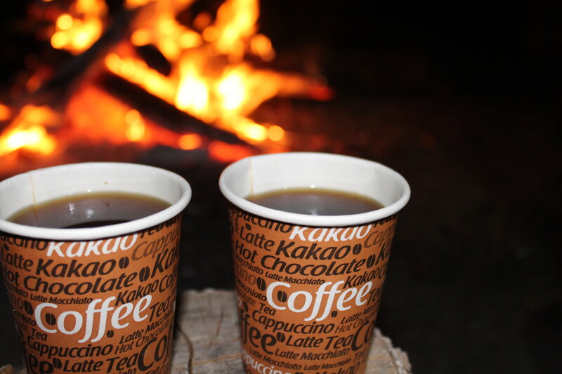 Two Coffee Cups by Fire