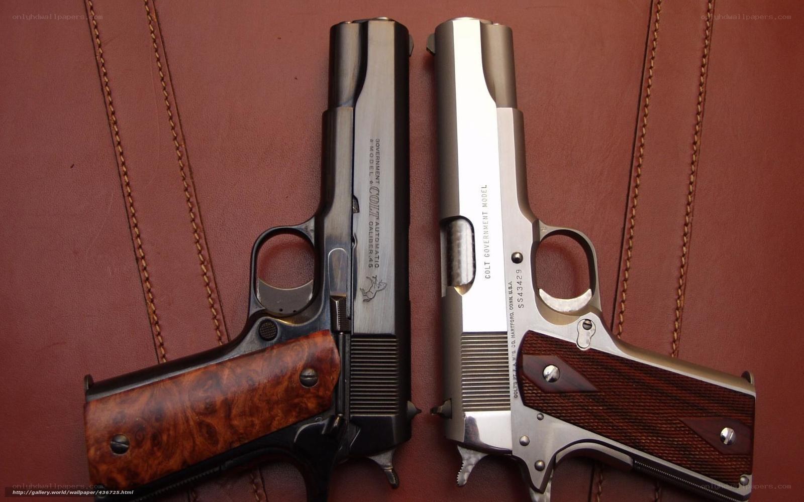 Two Colt pistols on leather