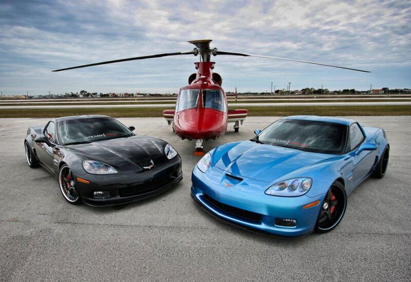 Two Corvette Cars and a Helicopter