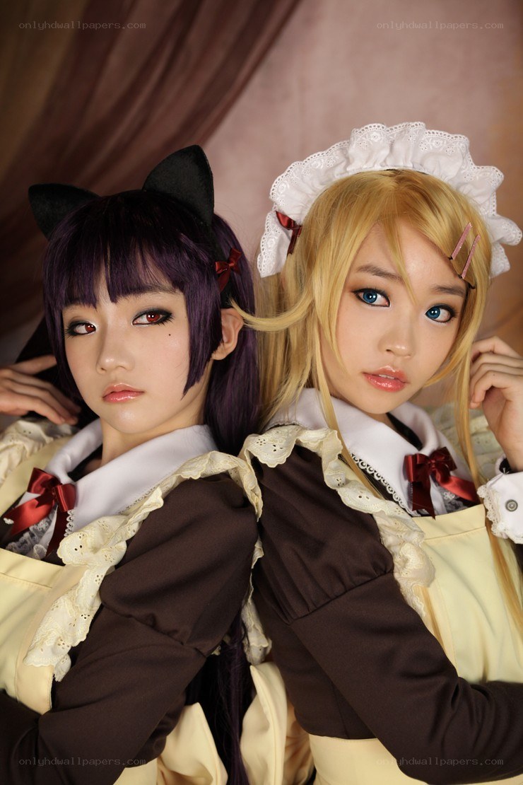 two cosplayers in maid outfits