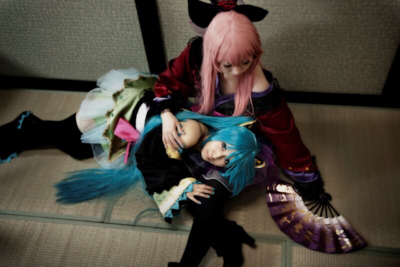 Two Cosplayers on Floor