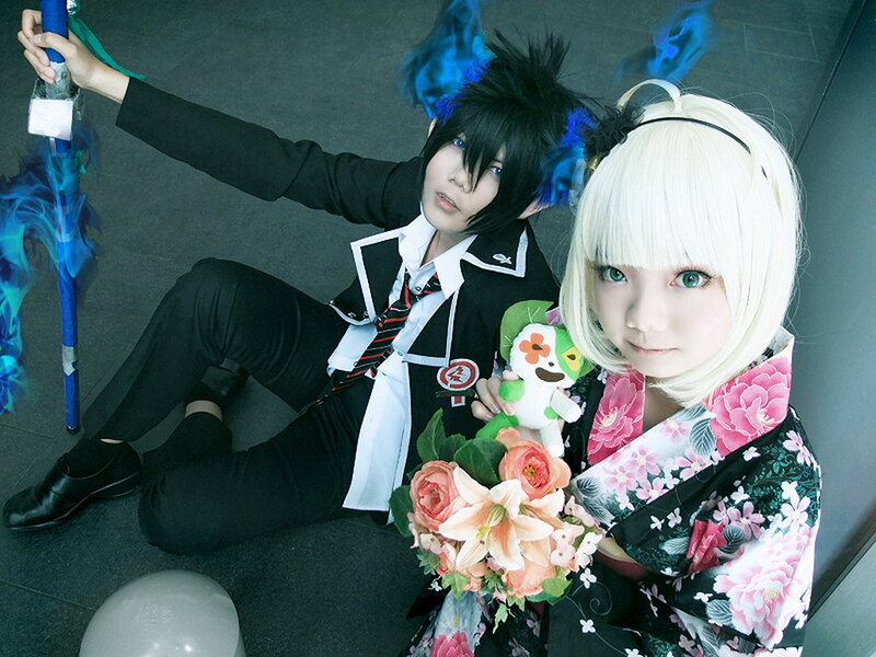 Two Cosplayers Sitting
