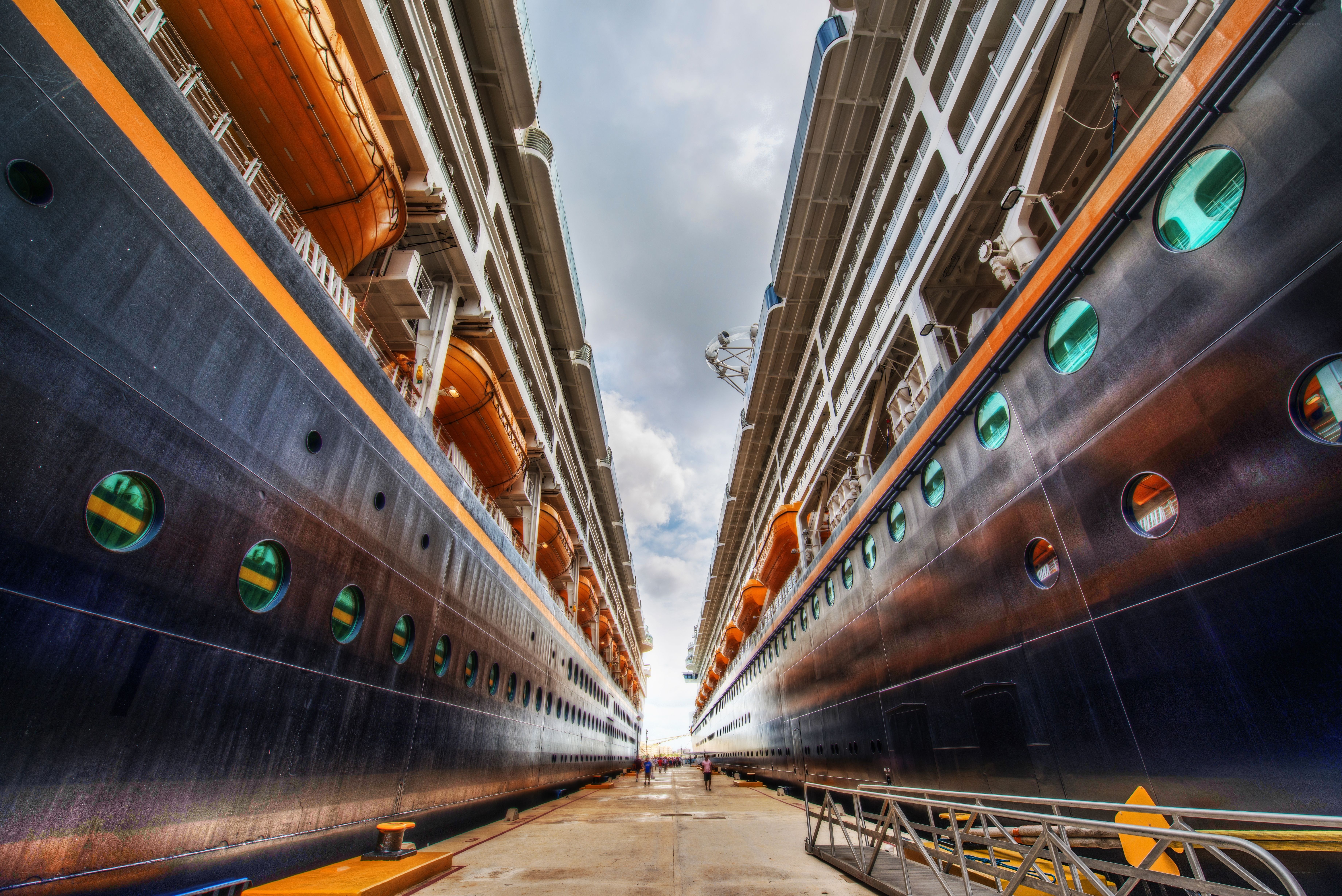 Two cruise ships docked side by side