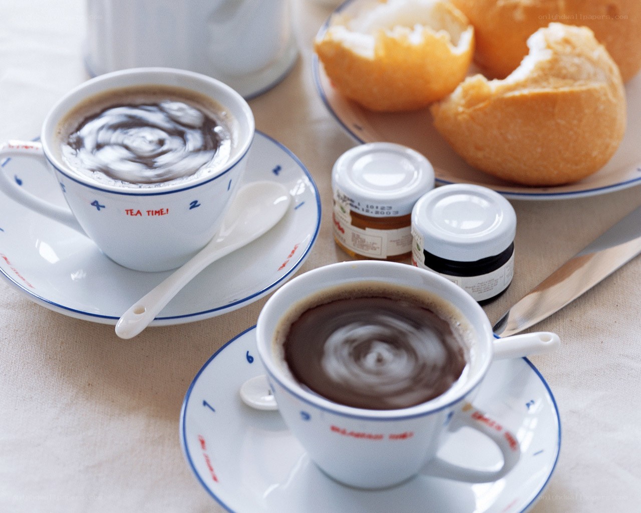 Two cups of coffee with bread