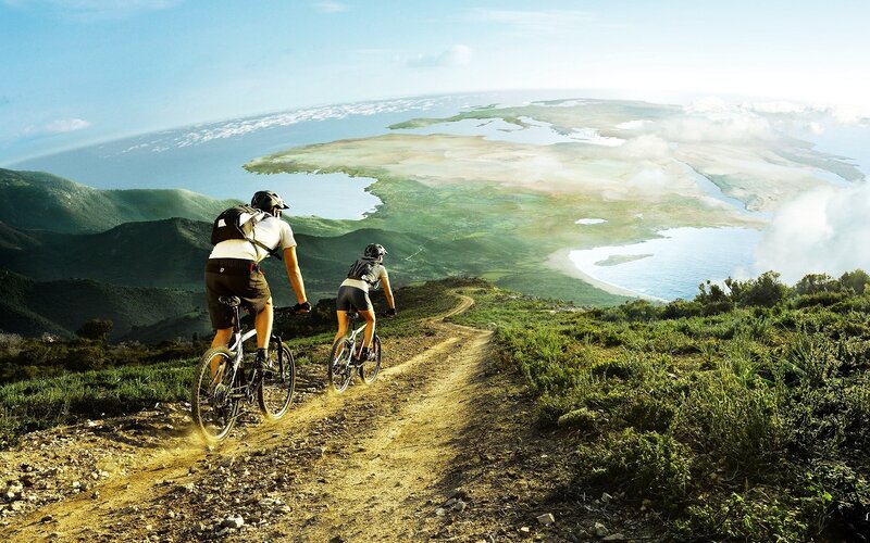 Two Cyclists on a Trail — Green, Serene, Afternoon, Photograph