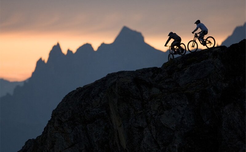 Two Cyclists on Mountain