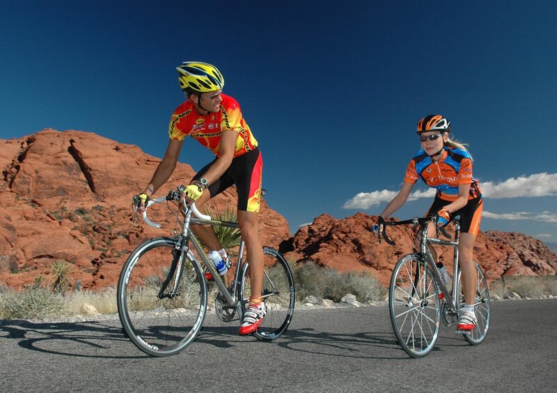 Two Cyclists on Road — Blue
