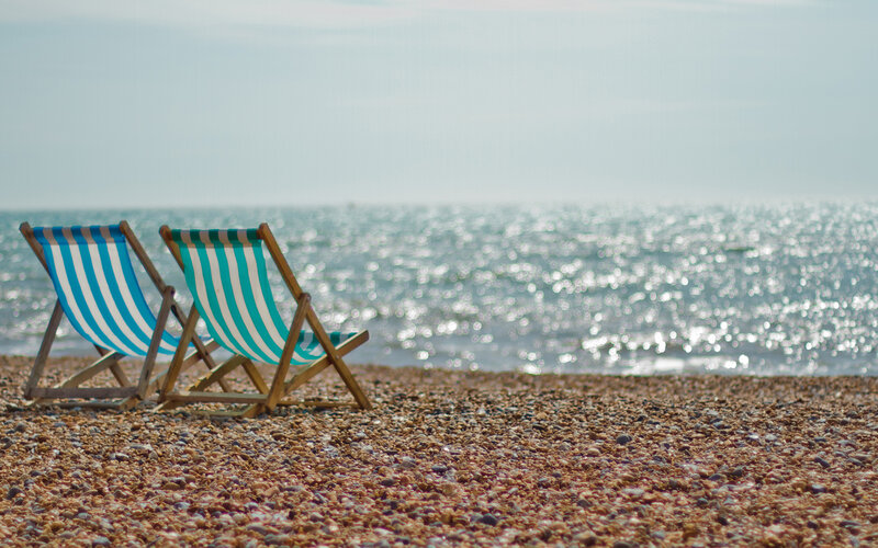 Two Deck Chairs on Beach