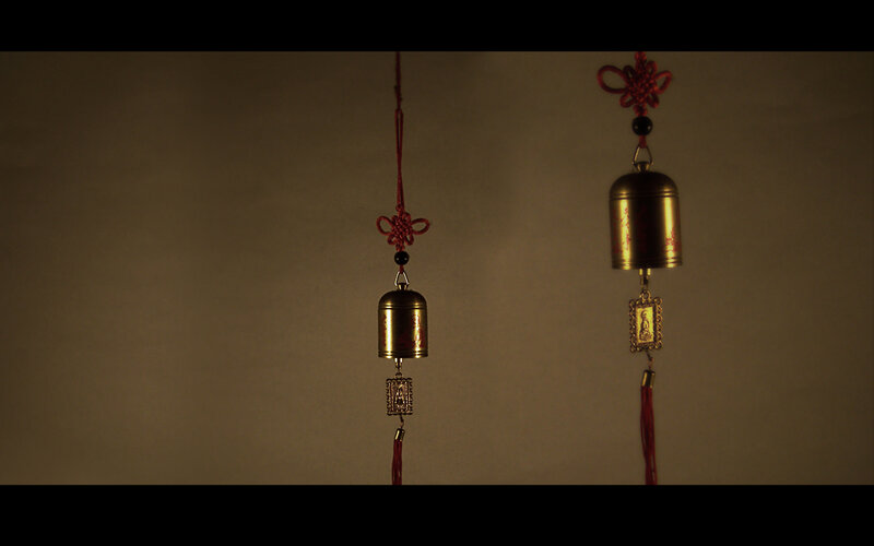 Two decorative bells with tassels