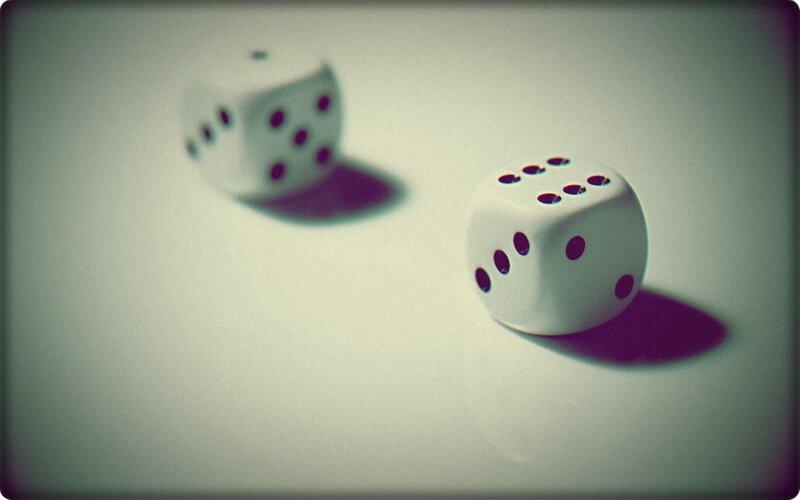 Two dice on a white surface