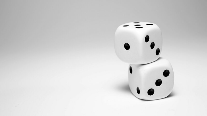 two dice stacked on white