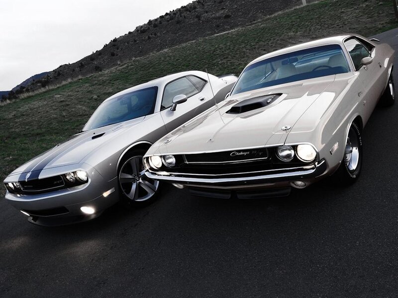 Two Dodge Challengers on a road
