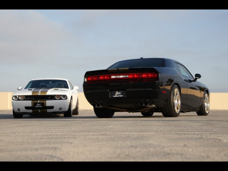 Two Dodge Challengers on a track