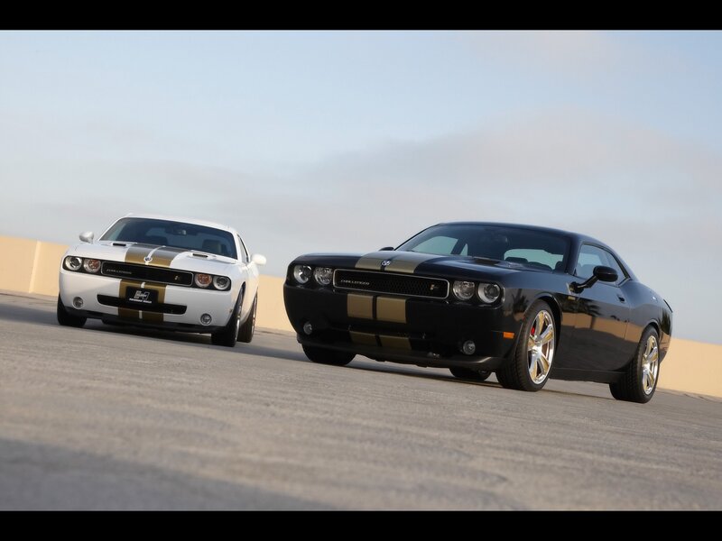 Two Dodge Challengers on track