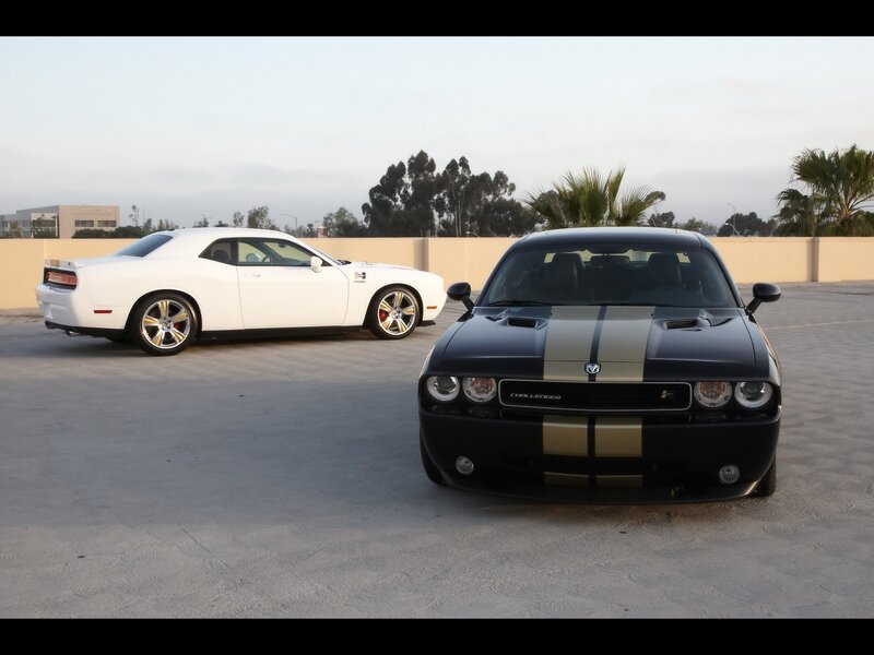 Two Dodge Challengers parked