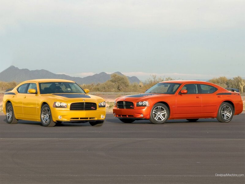 Two Dodge Chargers on a desert road